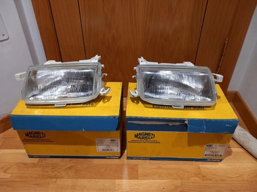 Opel Astra F GSI 16V Pareja Faros Reg. Eléctrica nuevos originales CARELLO.