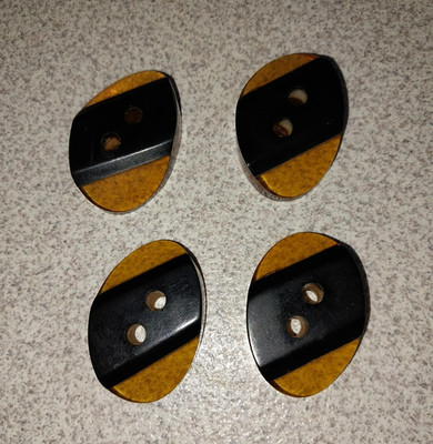 SET OF 4 VINTAGE BAKELITE AMBER APPLEJUICE & BLACK LAMINATE OVAL 1-1/2 X 1''