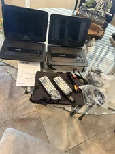 UEME PD-1010 10.1" Portable DVD Players. Set of 2. New. Open box.