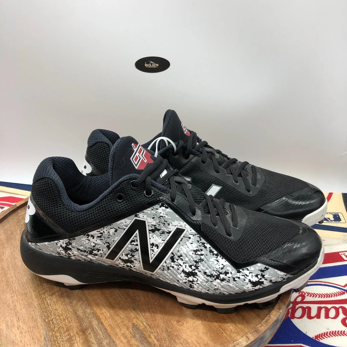 New balance sales camo baseball cleats