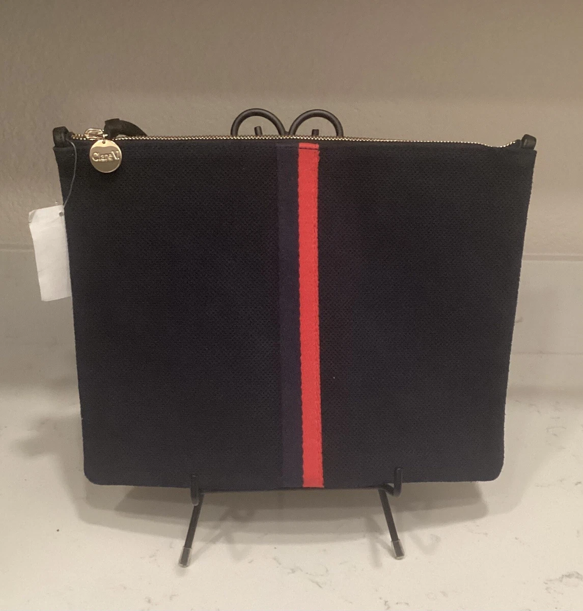 CLARE V FLAT NAVY BLUE CLUTCH RED STRIPE