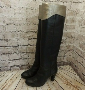 black and gold over the knee boots