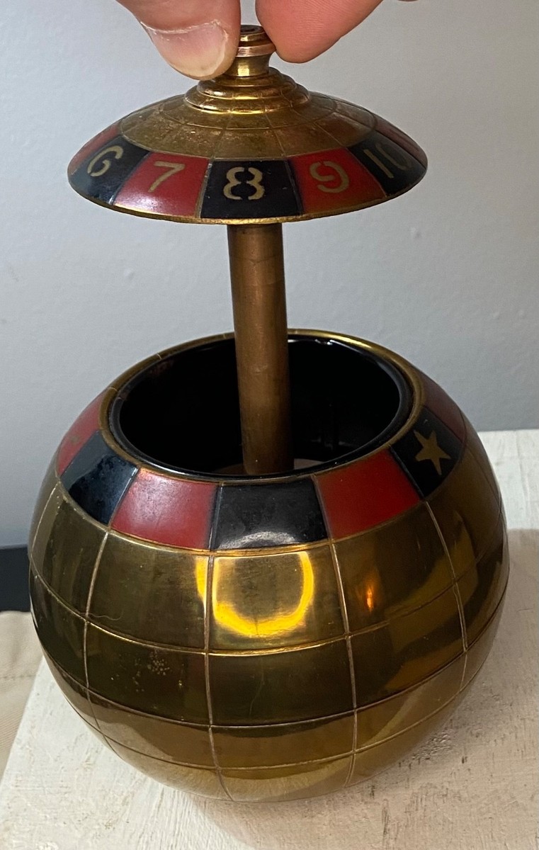 roulette wheel cigarette dispenser MCM “Mad Men” Roulette Cigarette Dispenser