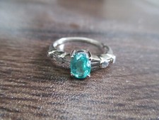 Genuine Emerald Solitaire and 4 genuine diamo...