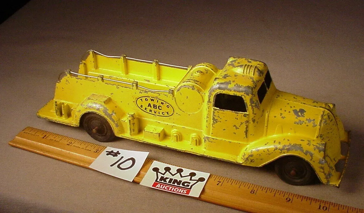 Yellow tow truck best sale toy
