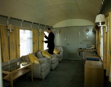 The Queen's lounge Royal Train a member of staff arranging curtain- Old Photo