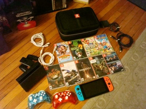NINTENDO SWITCH CONSOLE GAMING SYSTEM  2 CONTROLLERS AND 9 GAMES LOT