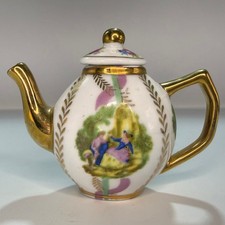 Vintage Porcelain Miniature Teapot with Gold Accents & Decorative Pattern Design