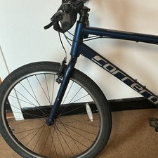 Carrera Hybrid Bike 700C M Frame Blue Flat Bar V-Brake Derailleur Gears