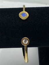 Kate Spade Golds Tone Emalia Łopata Otwarty mankiet Bransoletka