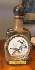 Jim Beam decorative bottles two. Head of a deer and 2 seagulls flying