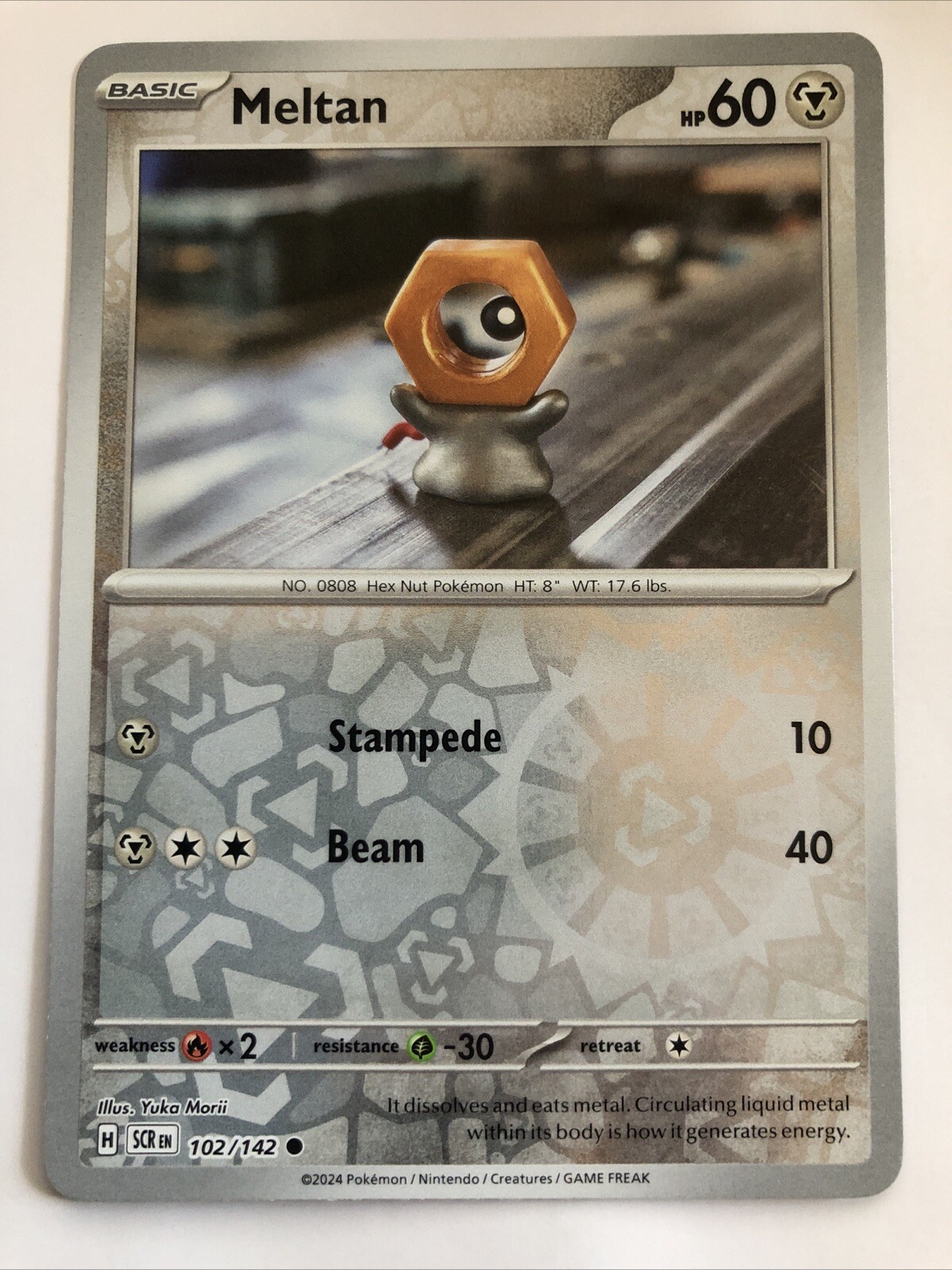 Pokémon TCG Stellar Crown Meltan Reverse Holofoil 102/142 NM