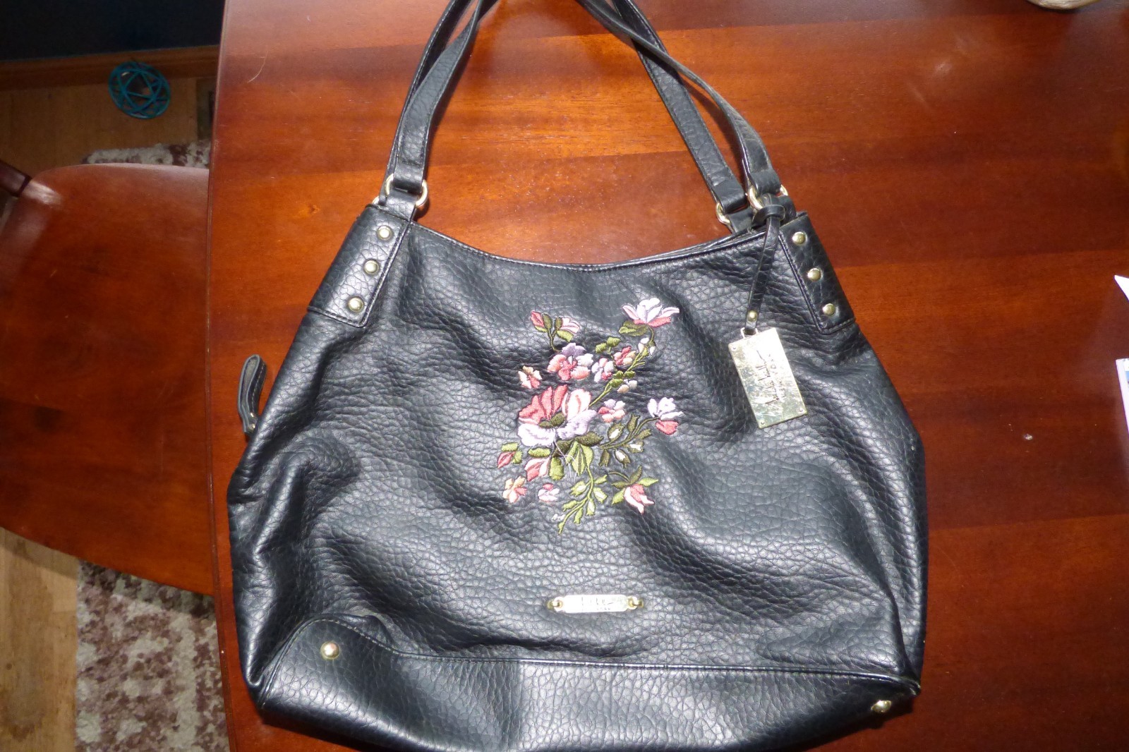 BLACK FAUX LEATHER HANDBAG WITH FLOWER EMBROIDERY AND LOTS O