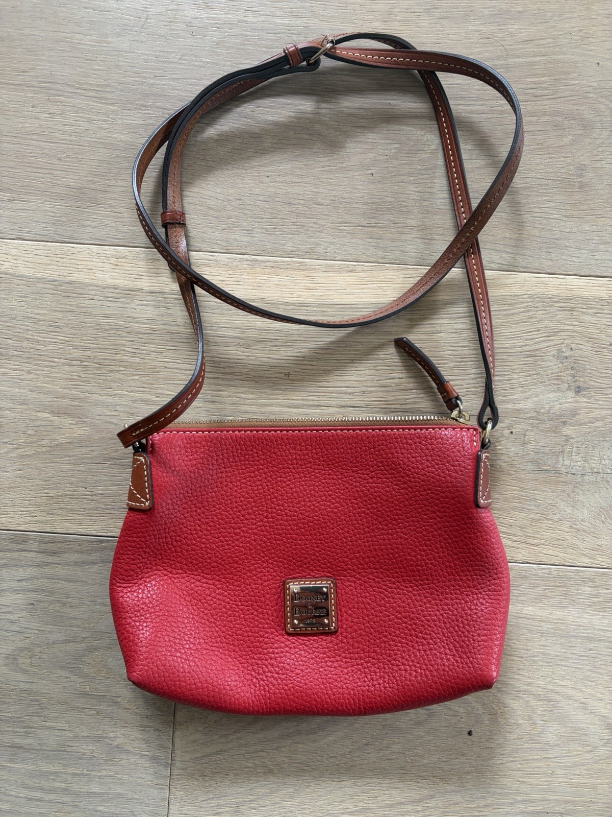 Dooney & Bourke Pebble Grain leather Crossbody Pouchette in red