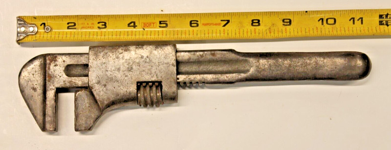 Vintage ADJUSTABLE AUTO WRENCH with Tire Spoon Handle Cadilac?