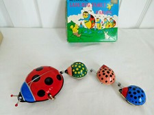 Wind up LADY BUG FAMILY PARADE w/box and Key Works well Goes in Circles vintage