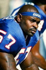 New York Giants linebacker Corey Miller sitting on the bench durin- Old Photo
