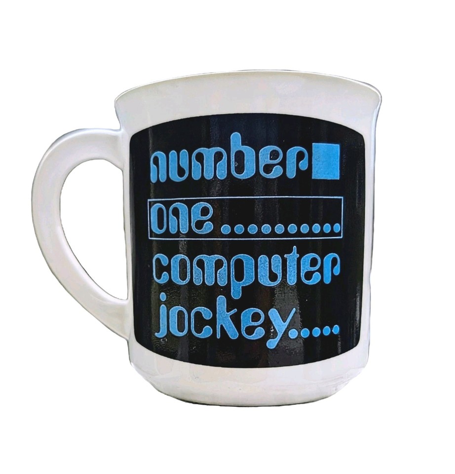 A deadpan 80s mug celebrating the unsung hero of the early PC era — 'Computer Jockey' is the perfect retro desk flex.