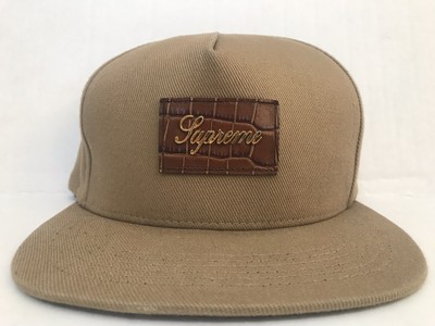 tan hat with leather strap