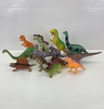 lot of 12 assorted hard plastic dinosaurs 6" X 12" multicolor and sizes