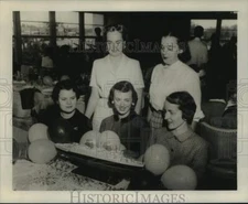 1958 Press Photo Mrs. Cornelius Lewis, company with balloon decorated model ship