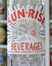 SUN RISE BEVERAGES, SUN-RISE INC. 10 OZ. CLEAR ACL CROWN TOP SODA BOTTLE