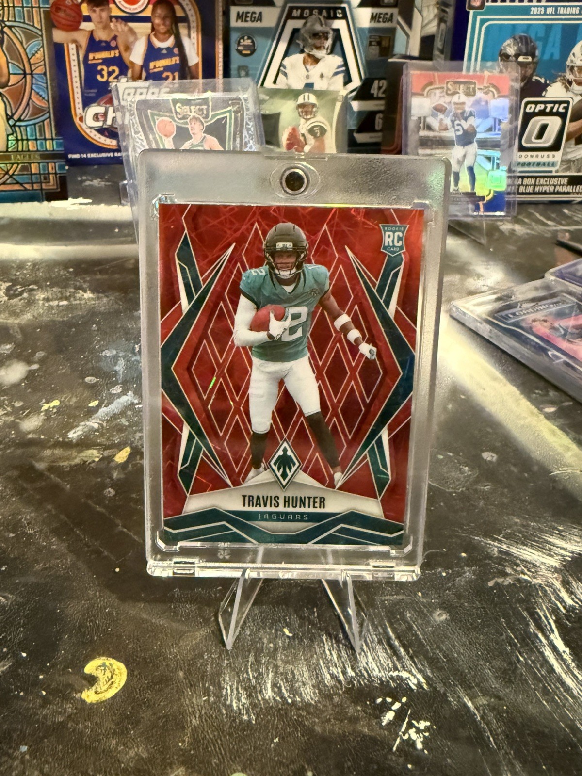 2025 Panini Phoenix - Rookies Travis Hunter #157 Red Lazer /199 (RC)