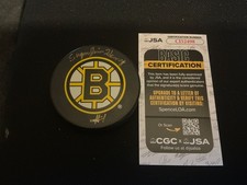 Autographed puck of  Sugar Jim Henry.  TOUGH !       JSA. CERT