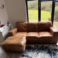 DFS Brown Leather Sofa With Matching Storage Footstool. 3 Seats with a Chaise