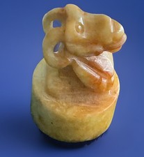 Chinese Carved Jade Dragon Seal on a Raised Circular Base Contrasting Yellows