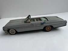 1961 Oldmobile 4-door convertible with retractable hardtop. Maker Unknown.