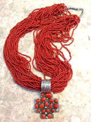 GILBERT SECATERO NATIVE AMERICAN CROSS PENDANT OF STERLING AND CORAL