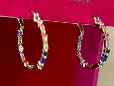 Gold-toned rainbow hoop earring adorned with small coloured gems or crystals