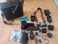 ASSORTED CAMERA LOT WITH BAG CANON AV-1 LENS CONVERTER VIVITAR FLASH THYRISTOR