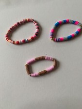 3 clay bead bracelets with lots of colors. Beads are made out of clay Stretchy