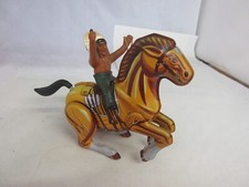 VINTAGE WIND UP TIN INDIAN ON HORSE KORES WORKS TOY 84