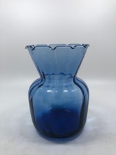 LIGHT BLUE GLASS VASE W/WAVE RIM.