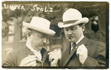 RPPC ~ "Unser Stoltz," 2 Men with Cigars Looking at Pins on Their Lapels