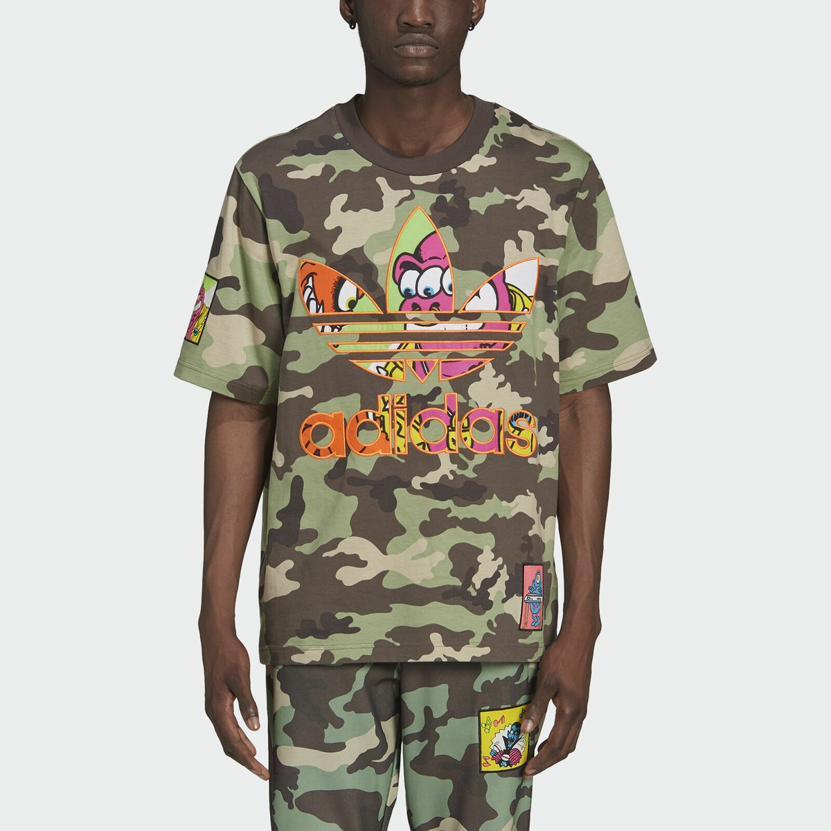 【adidas】Originals X JEREMY SCOTT ★ ロゴTシャツ adidas Originals x Jeremy Scott graphic T-shirt in pink | ASOS