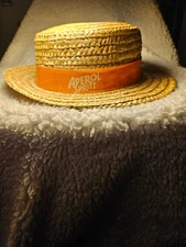 APEROL SPRITZ STRAW/POLYESTER LINING HAT W/ORANGE BAND. HEAD 7 INCHES DIAMETER