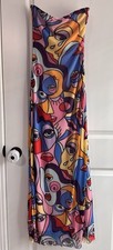 Bold maxi dress with abstract face design. Features Vibrant Colors Size M