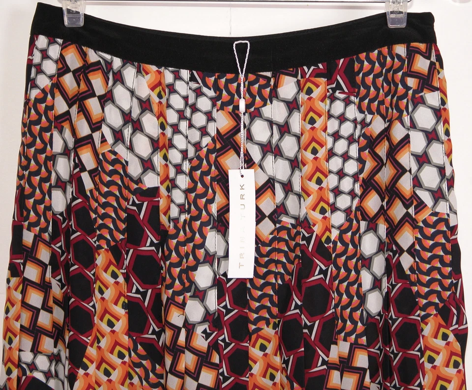 Falda plisada Trina Turk para mujer talla 8 estampado geométrico sin forro media pantorrilla cremallera lateral Foto 3 de 4