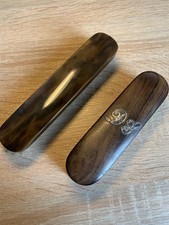 Two Antique clothes brushes. One with silver monogram