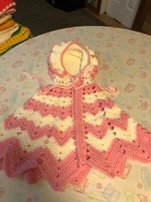 A magnificent handmade poncho with a cap .