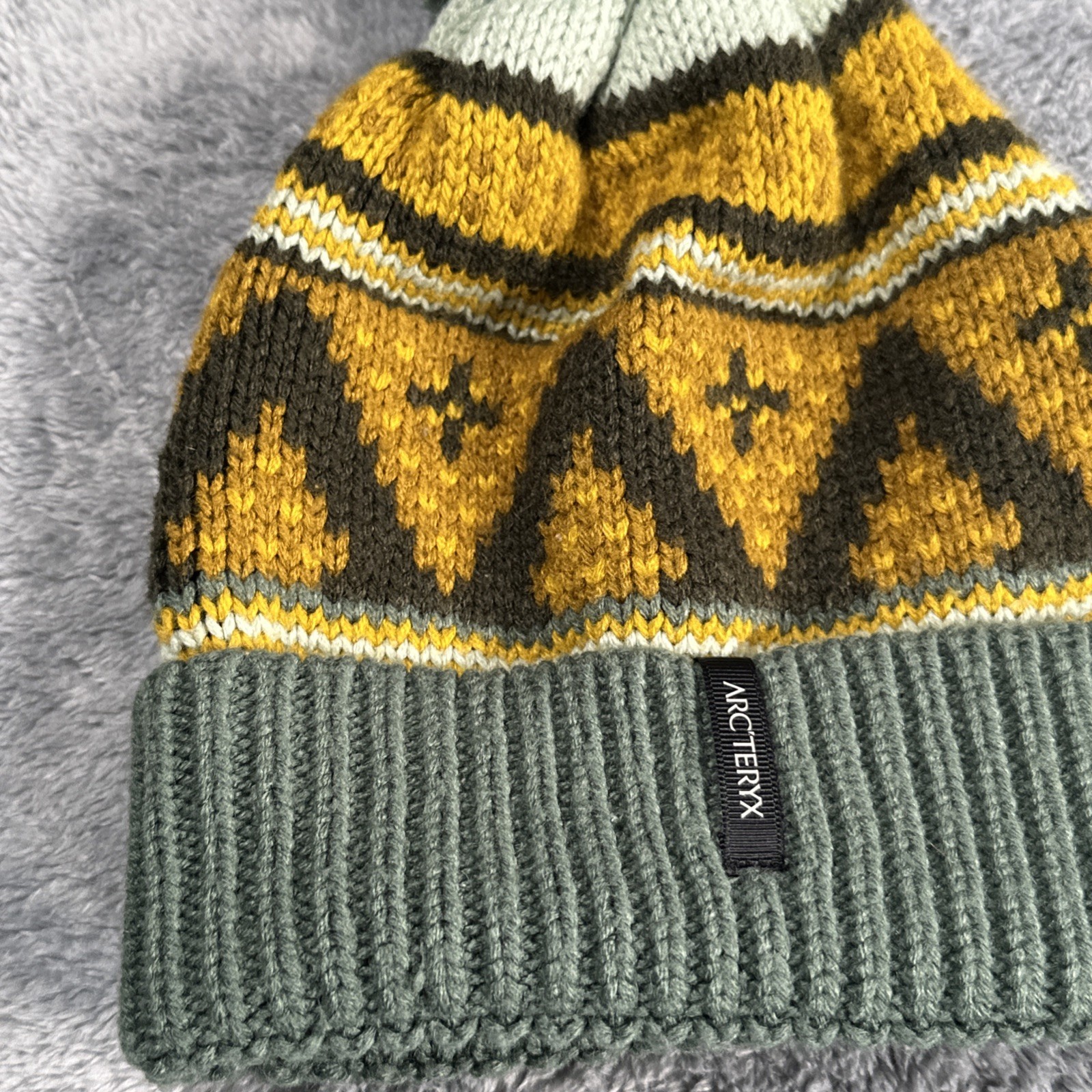 Cappello Arc'teryx unisex Fernie Toque in maglia con pom in misto lana Sundance OS