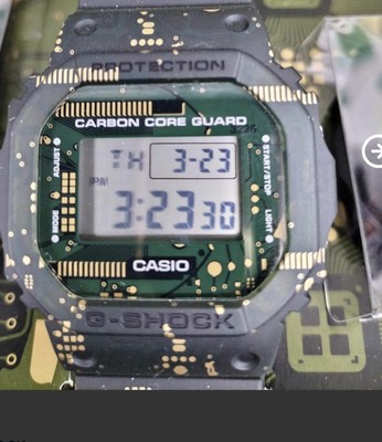 Casio G-Shock DWE-5600CC-3ER Resin Gehäuse mit grünem Kunststoffband Herren a...