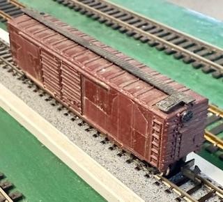 N Scale Atlas unlettered painted brown 50’ DD boxcar with Rapido couplers