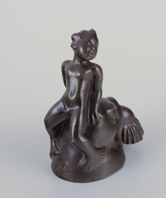 Just Andersen, Denmark. Figurine of a boy sitting on the head of a walrus.