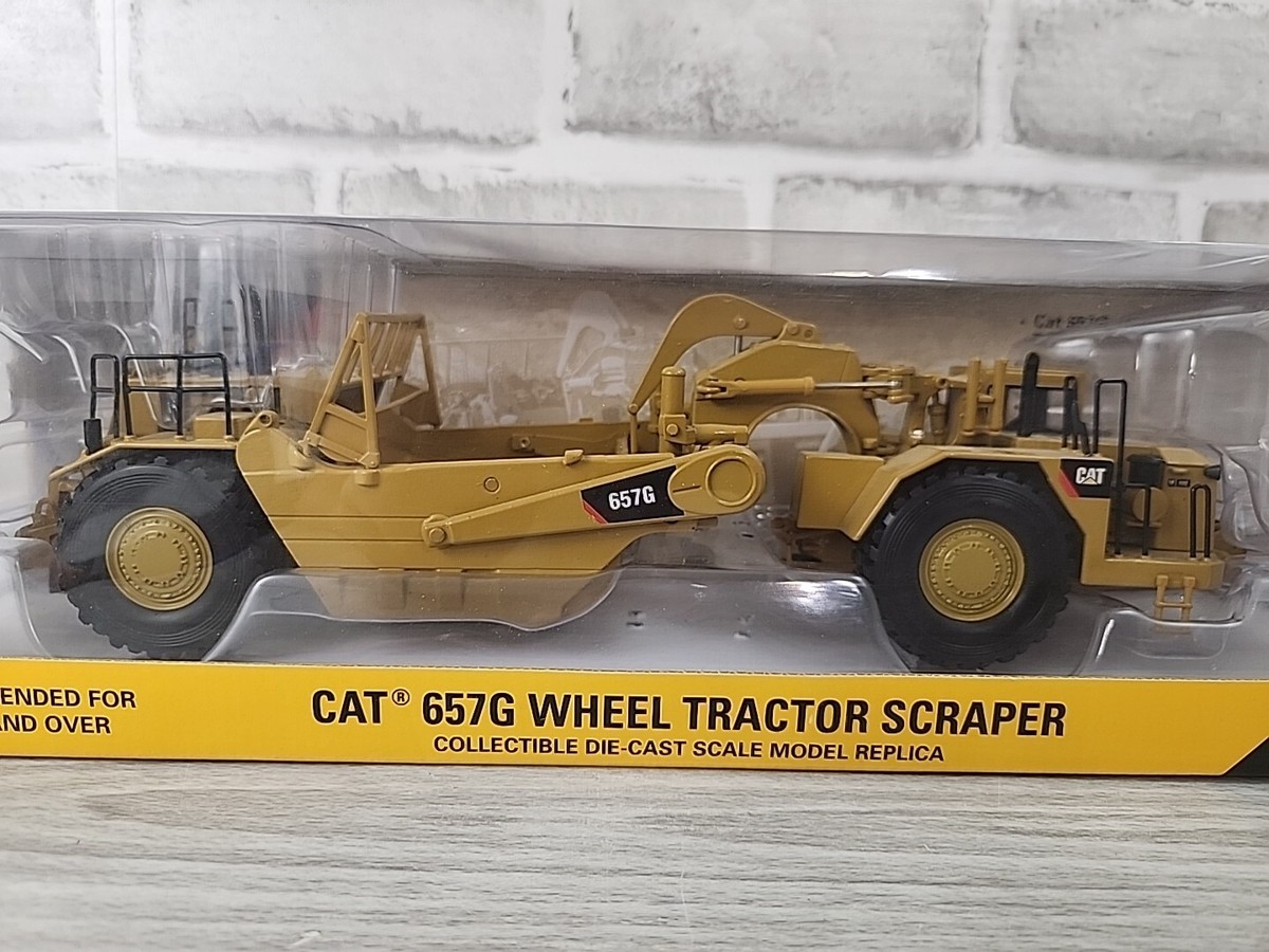 CAT 657G Wheel Tractor Scraper 1:50 Scale Collectible Die CAT 657G Wheel Tractor Scraper 1:50 Scale Collectible Die