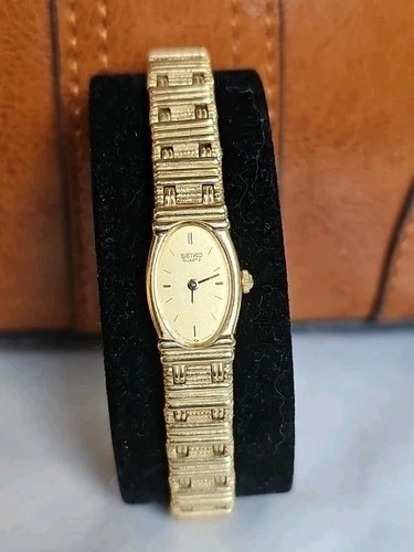 Vintage Seiko Watch Women Gold Dial Gold Tone Oval 1E20-5179 Needs Battery 1980s